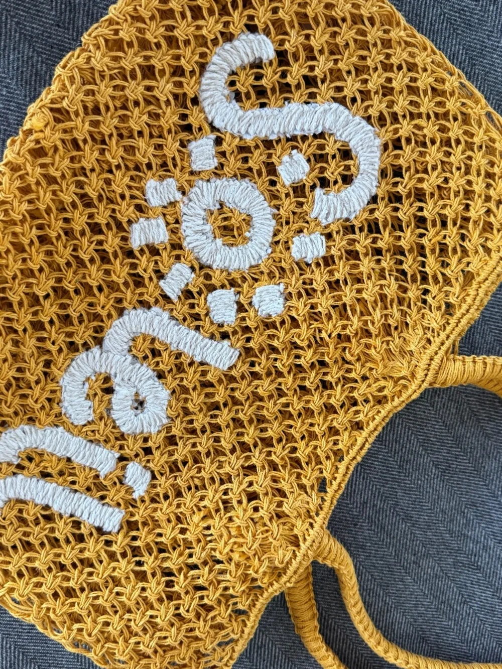 NWOT, RAFFIA WOVEN TOTE WITH DARLING “SOLEIL”